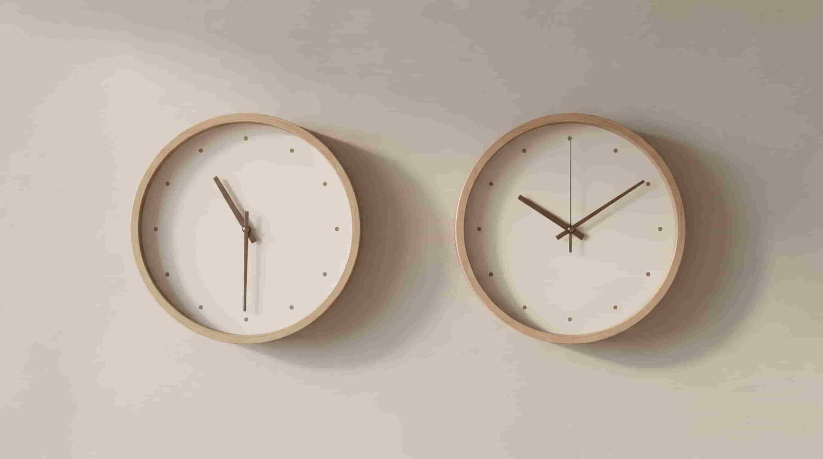 Two clocks showing Mumbai time and Dubai time side by side